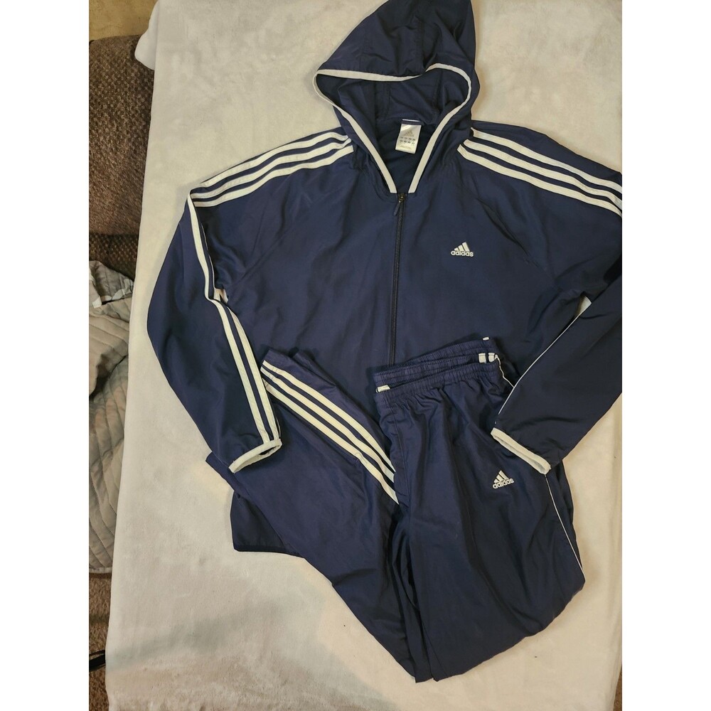 navy blue Adidas tracksuit featuring a hooded full-zip jacket and matching pants